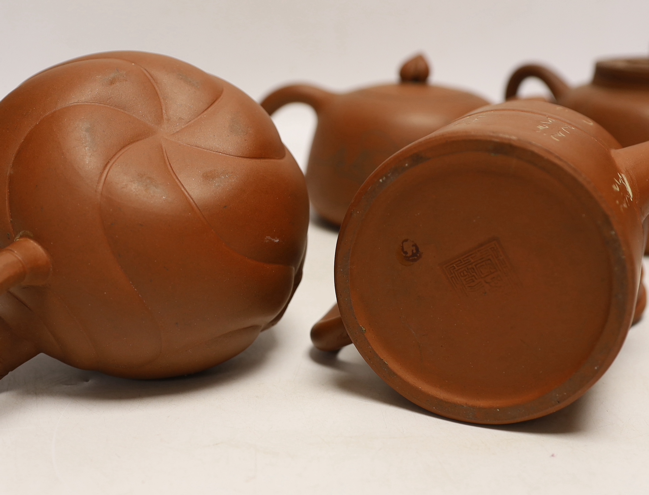 Six Chinese Yixing terracotta teapots, largest 11cm